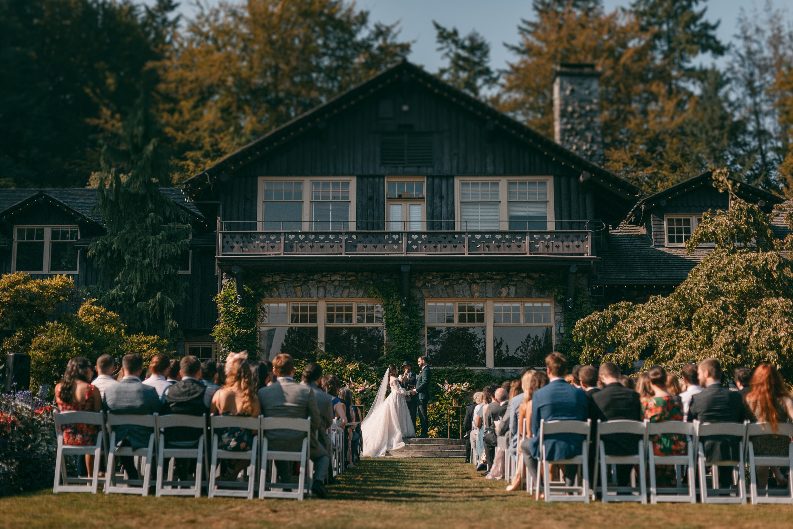 Destination Wedding in Vancouver at Stanley Park Pavillion - couple gets married in front of the Stanley Park Pavilion